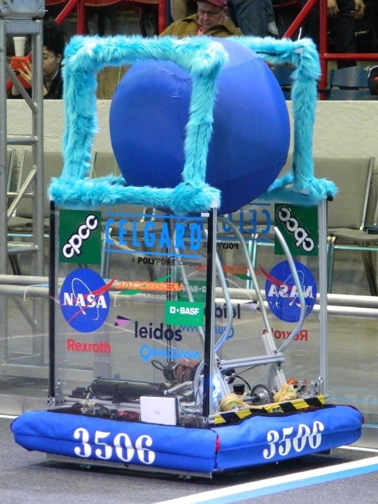 Fluffy, the 2014 robot, holding a large yoga ball
