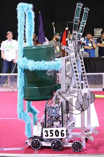 Frostbyte, the 2015 robot, with its arm raised on the field