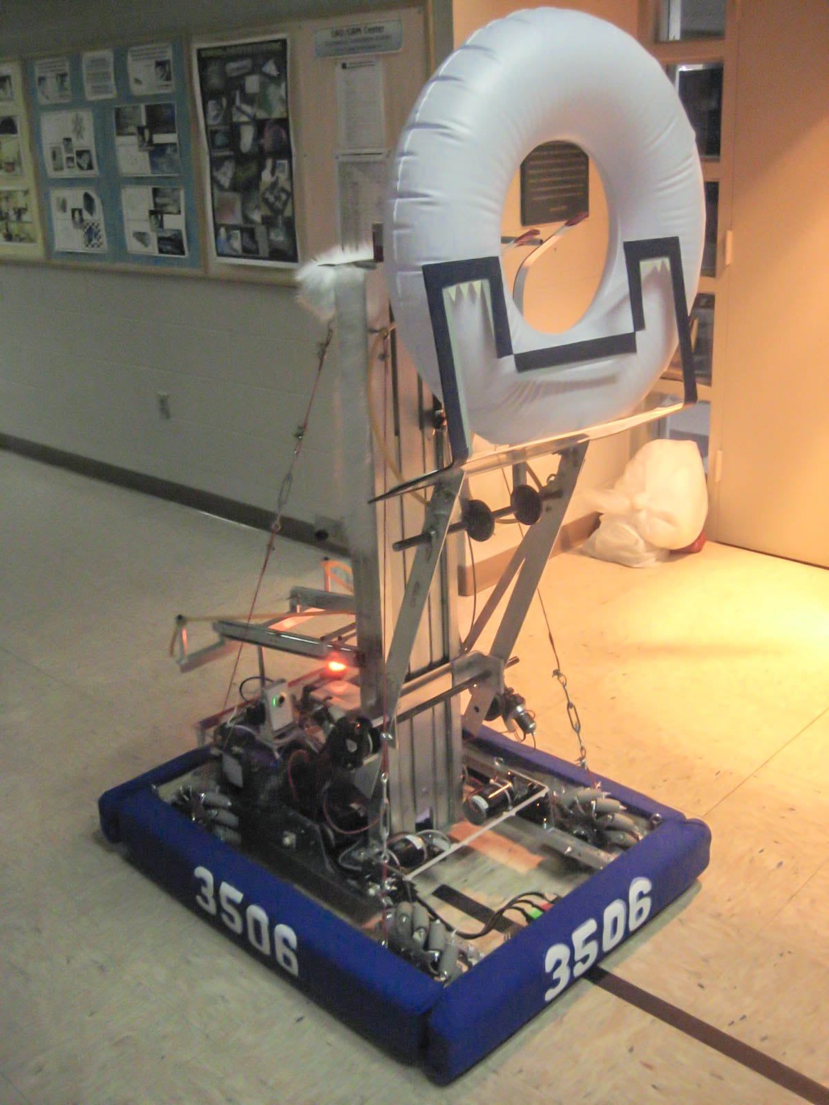 Wampa, the 2011 robot, on the practice field beside a scoring hoop